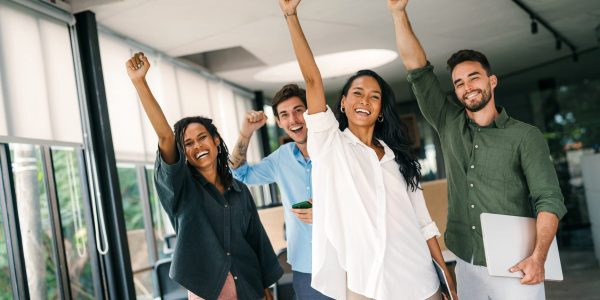 Success diverse group of multiethnic entrepreneurs and business people achieving goals in corporate office